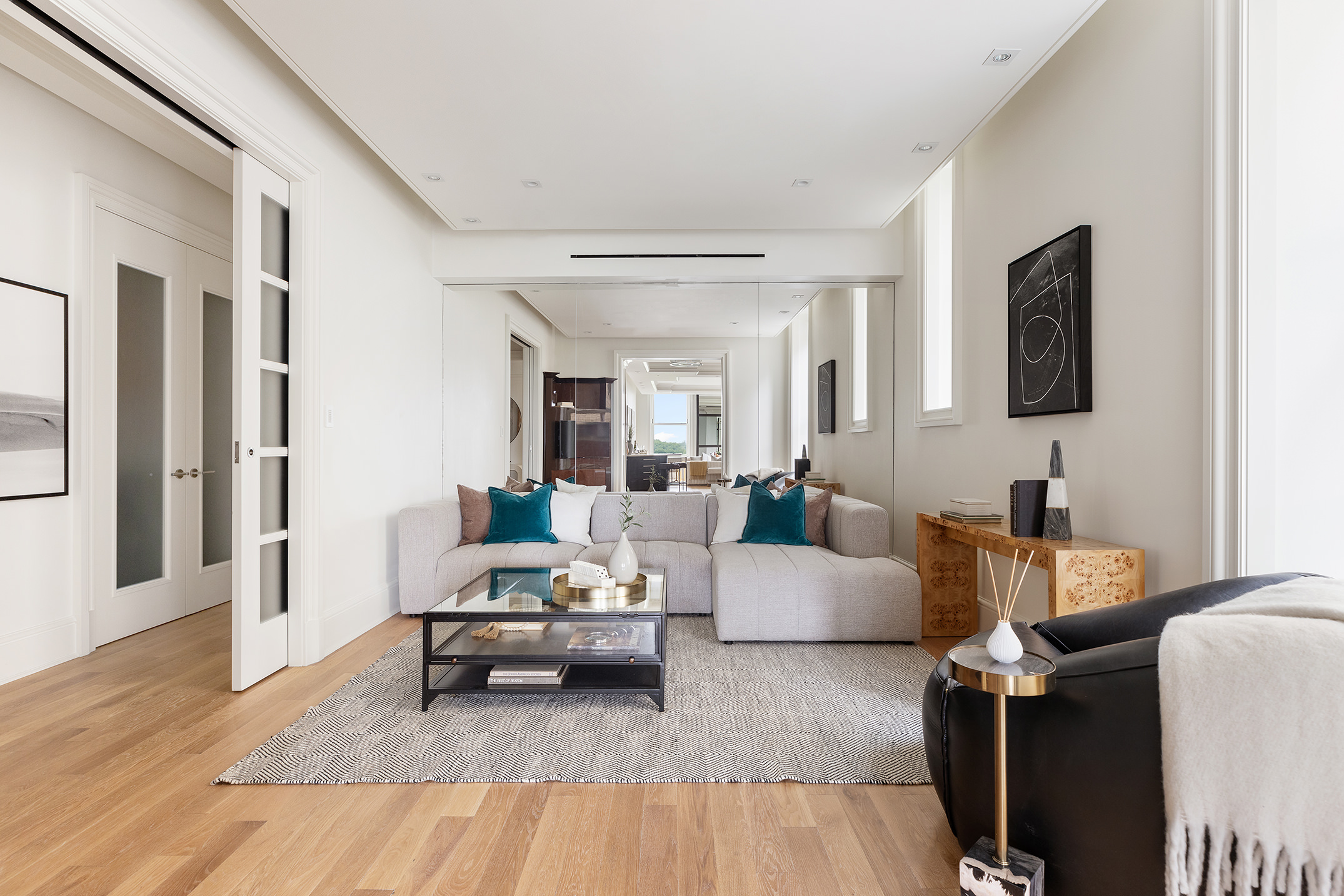 1 Central Park South, Unit 8010203 Manhattan, NY 10019 - Photo 25 of 45 a living room with furniture and a couch