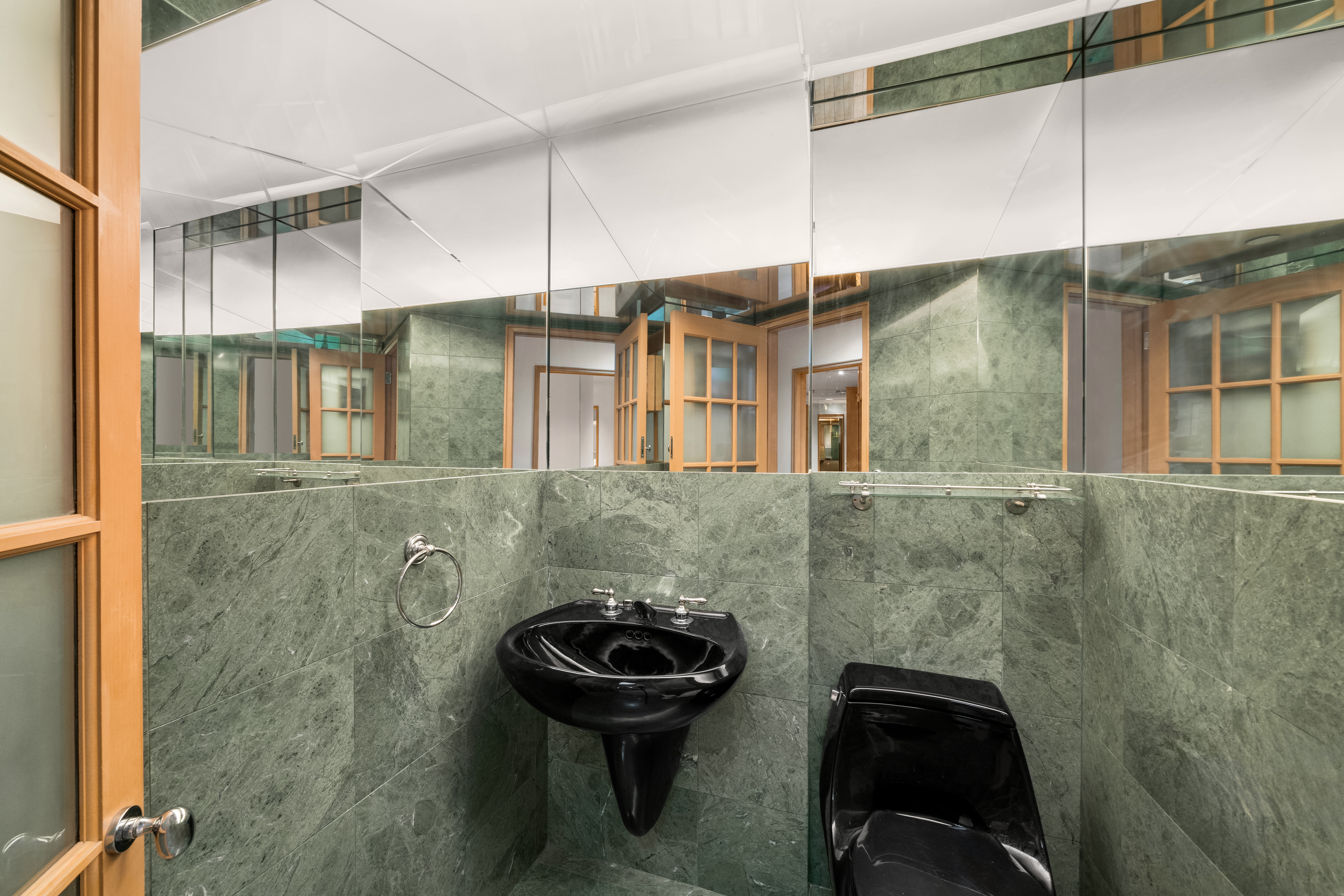 131 Mercer Street, Unit 2B Manhattan, NY 10012 - Photo 13 of 18 a bathroom with a sink a toilet and shower