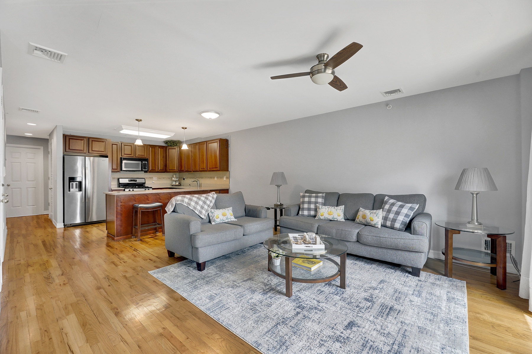 10220 Rockaway Beach Boulevard, Unit 3C Queens, NY 11694 - Photo 4 of 46 a living room with furniture and kitchen view