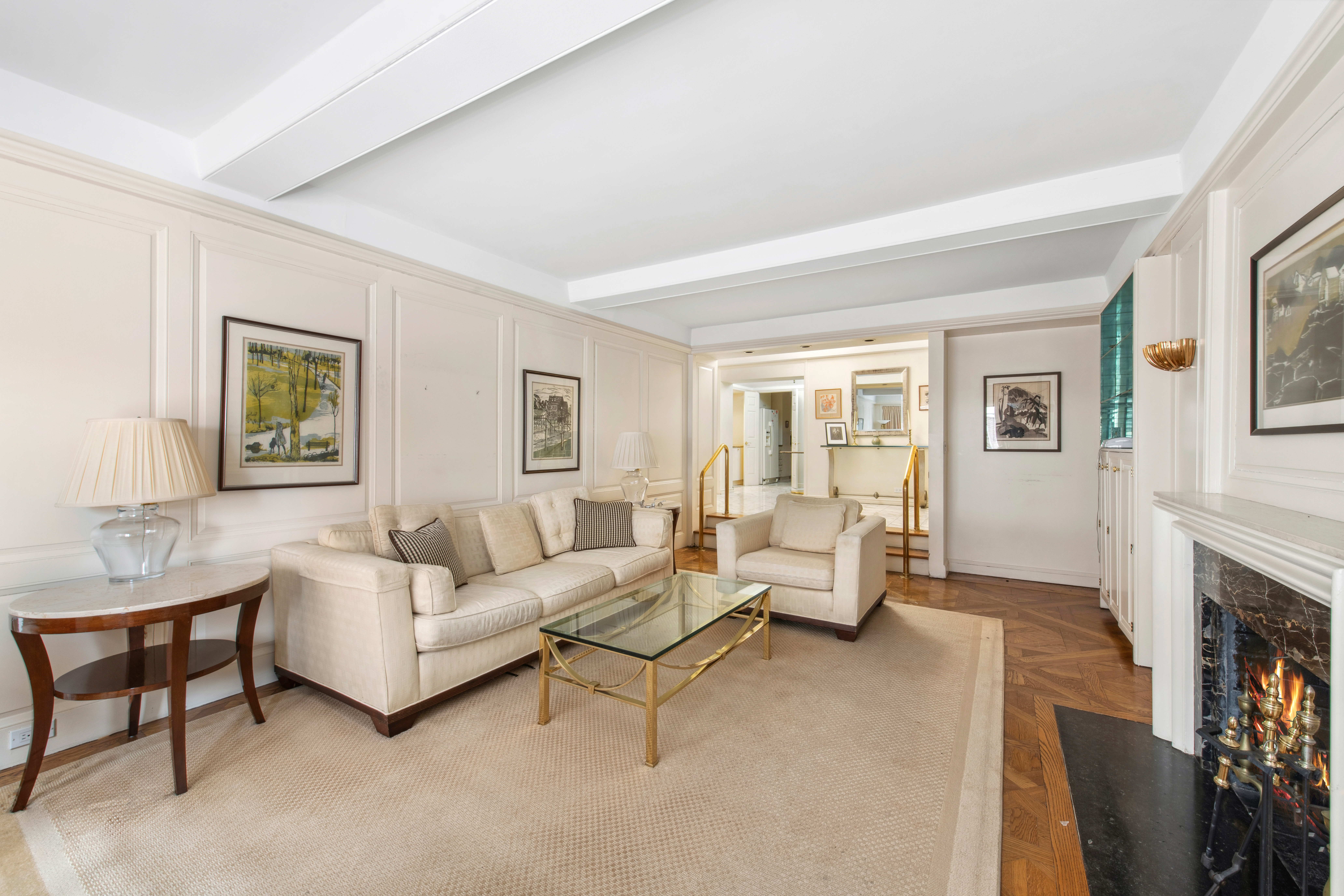 2 Sutton Place South, Unit 7F Manhattan, NY 10022 - Photo 3 of 18 a living room with furniture and a fireplace