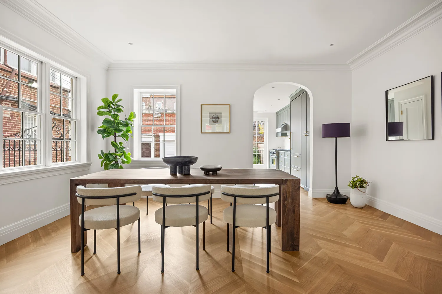 a view of a dining room with furniture and window