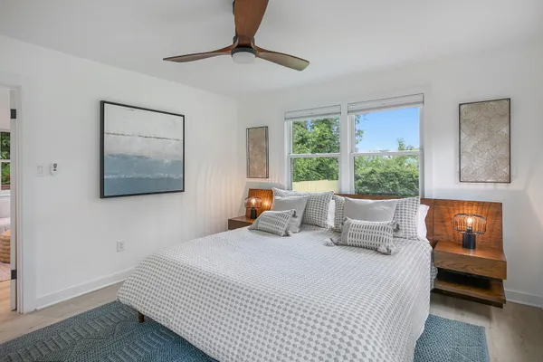 a bedroom with a large bed and a window