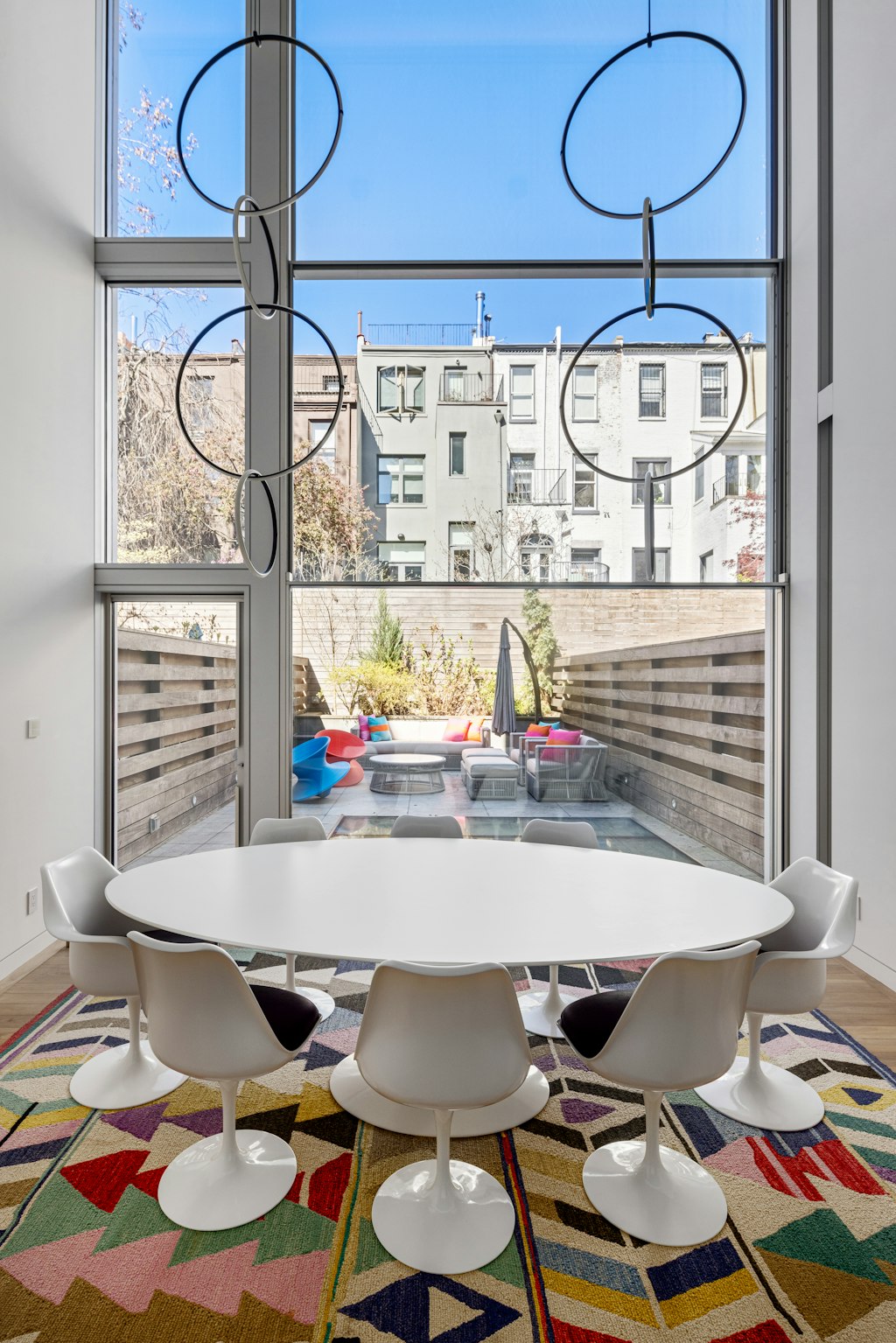 125 West 87th Street Manhattan, NY 10024 - Photo 9 of 27 a room with table chairs and a chandelier