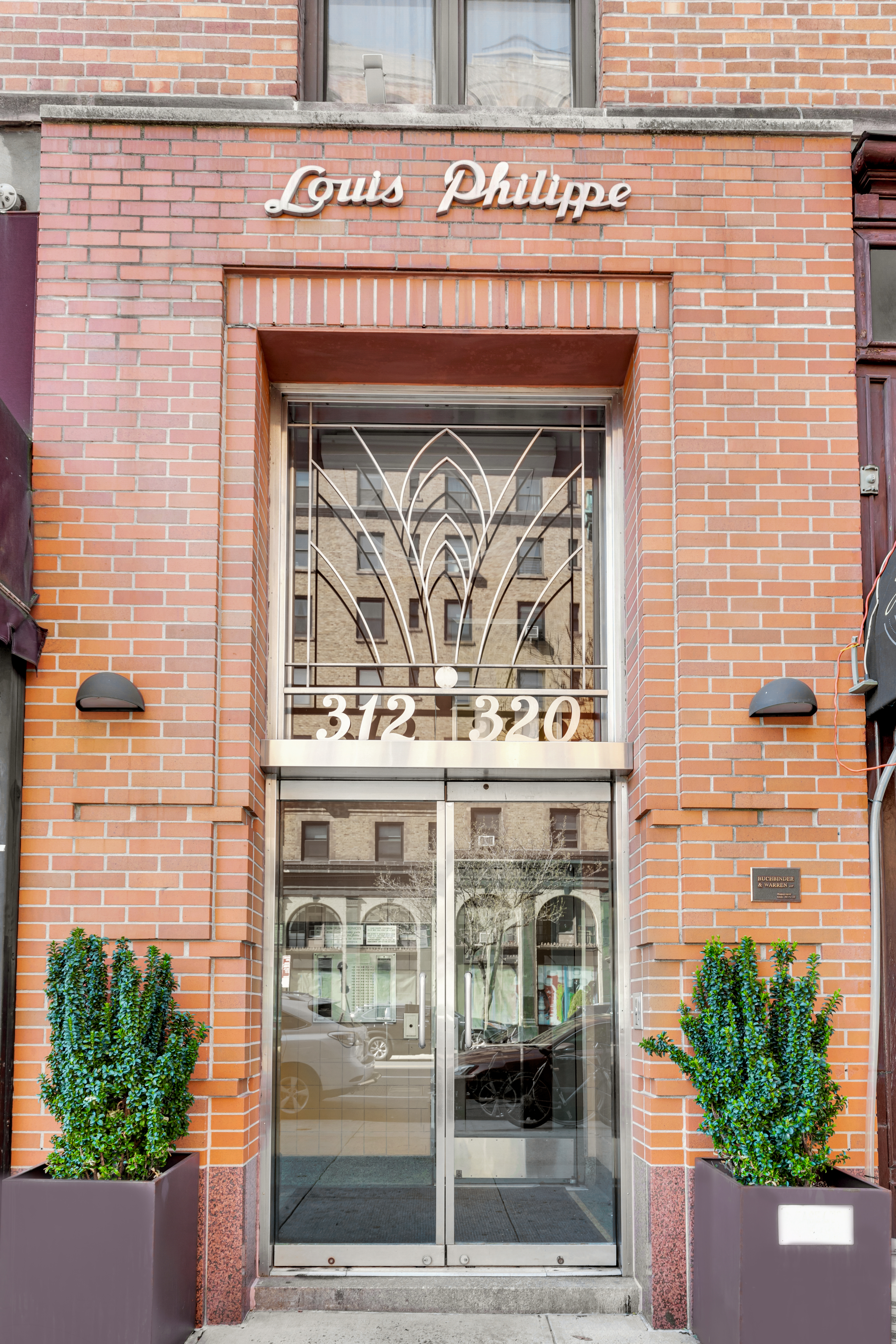 312 West 23rd Street, Unit 3R Manhattan, NY 10011 - Photo 5 of 6 a front view of a building with garden