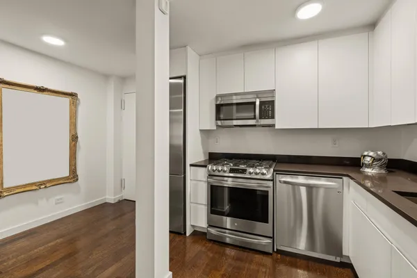 a kitchen with a stove and a microwave