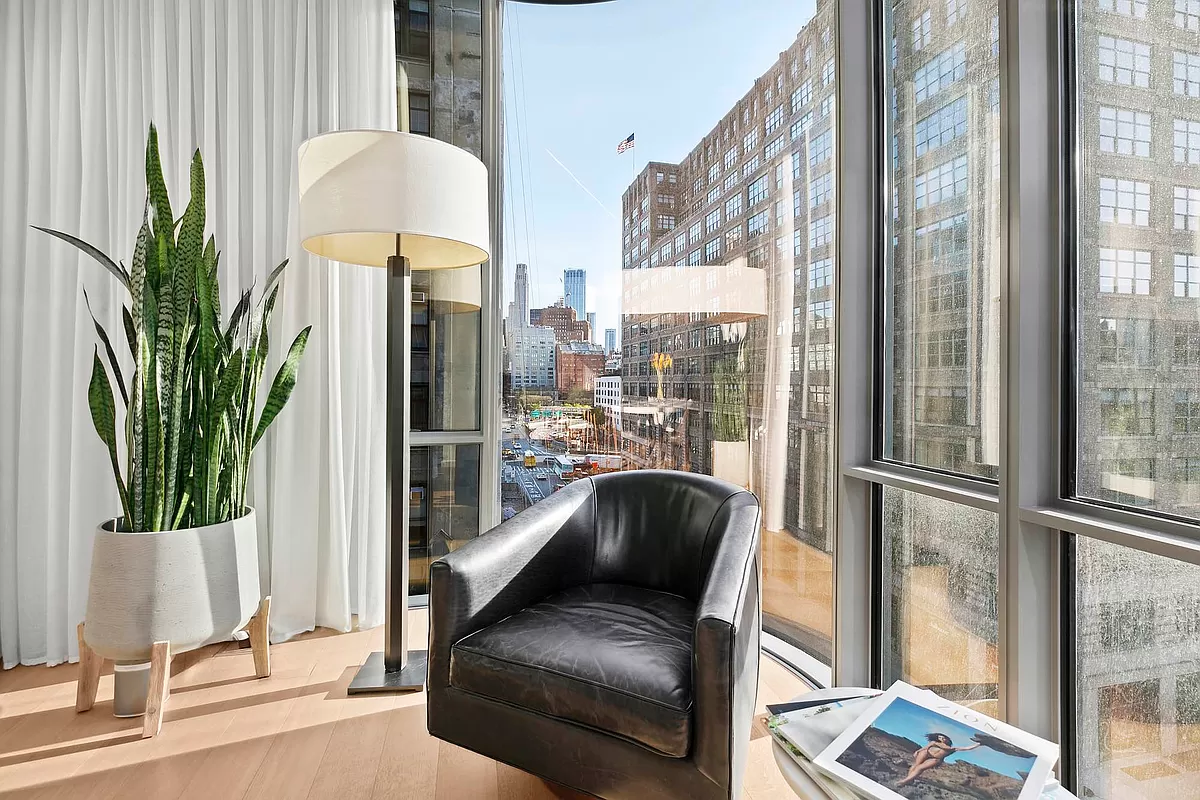 565 Broome Street, Unit S8C Manhattan, NY 10013 - Photo 11 of 24 a living room with furniture and a potted plant