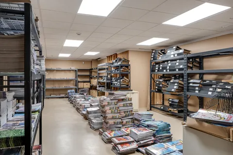 a view of a street with a garage