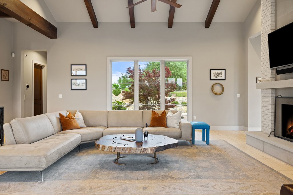 2560 Bell Springs Road Dripping Springs, TX 78620 - Photo 42 of 42 a living room with fireplace furniture and a flat screen tv