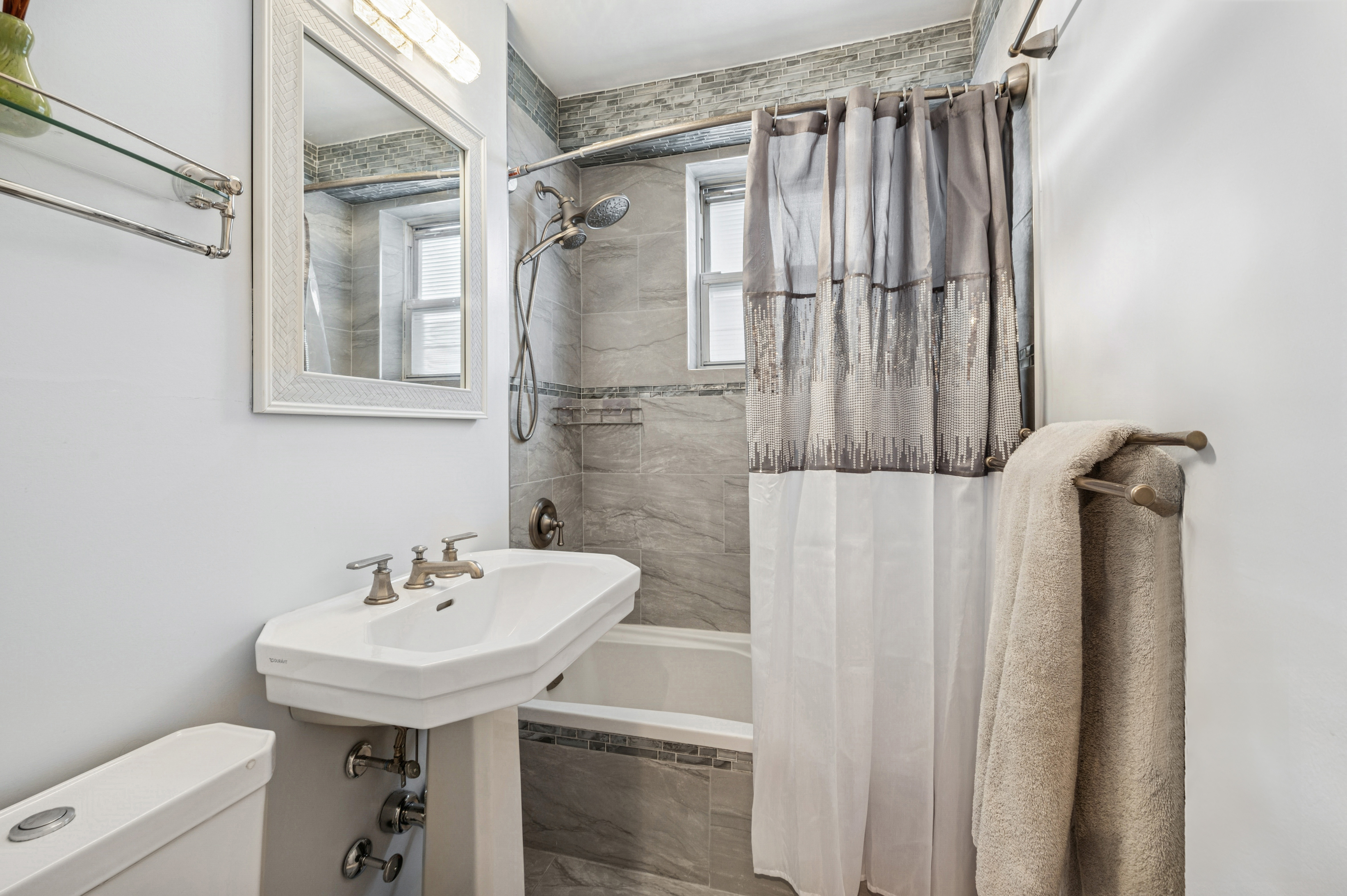 5700 Arlington Avenue, Unit 7G Bronx, NY 10471 - Photo 6 of 16 a bathroom with a sink and mirror