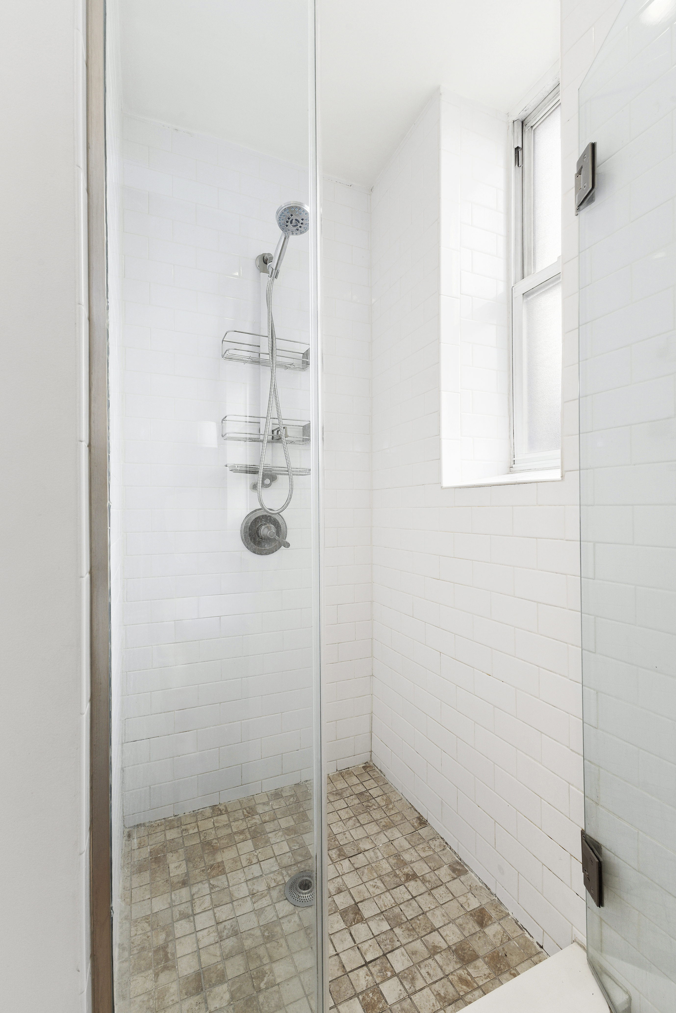 124 Thompson Street, Unit 21 Manhattan, NY 10012 - Photo 7 of 10 a bathroom with a shower