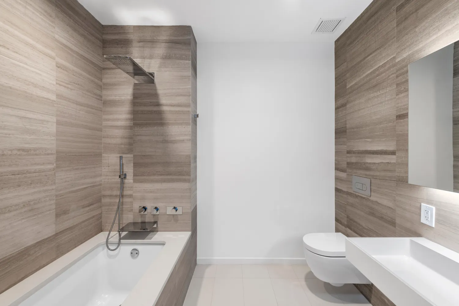 a bathroom with a bathtub and shower