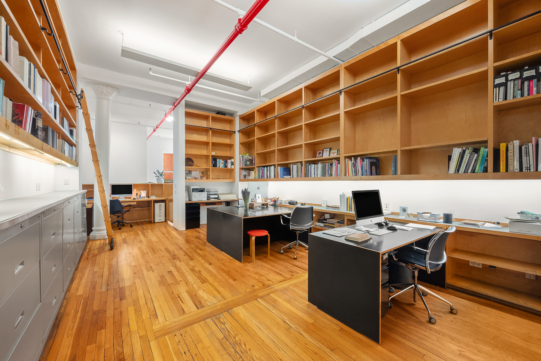 59 Wooster Street Manhattan, NY 10012 - Photo 6 of 10 a bed room with a bed and a table