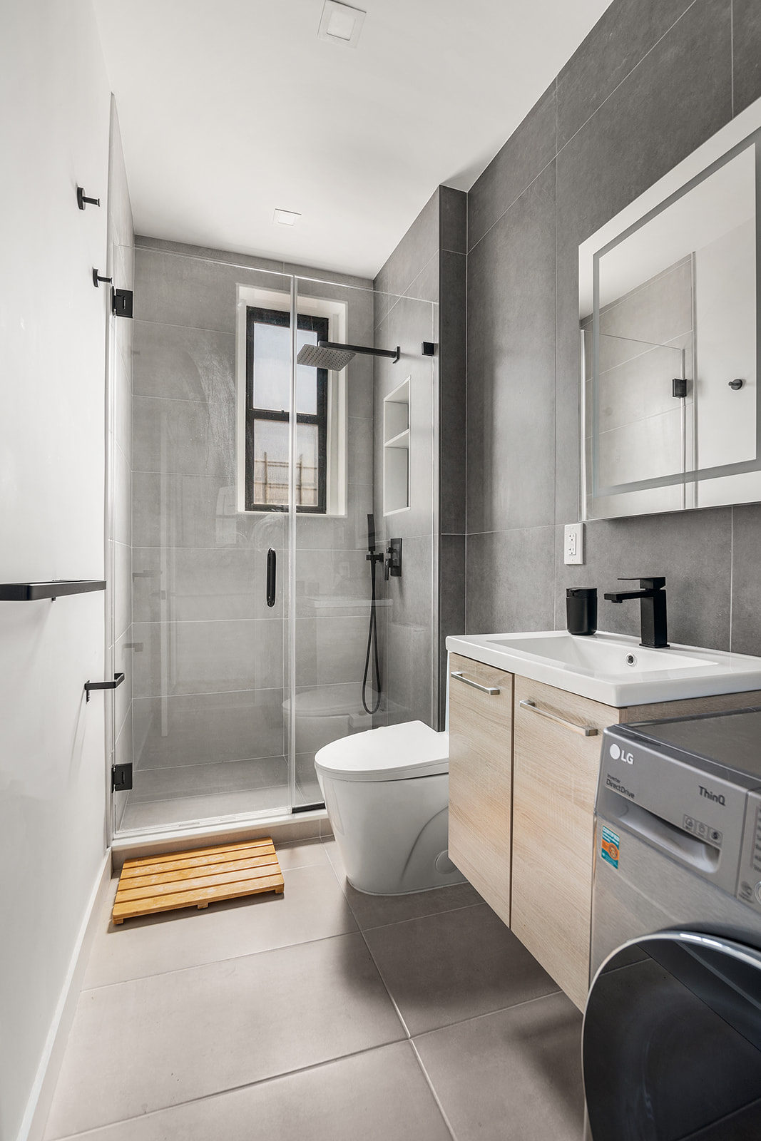 834 Riverside Drive, Unit E6 Manhattan, NY 10032 - Photo 4 of 22 a bathroom with a toilet a sink and a shower