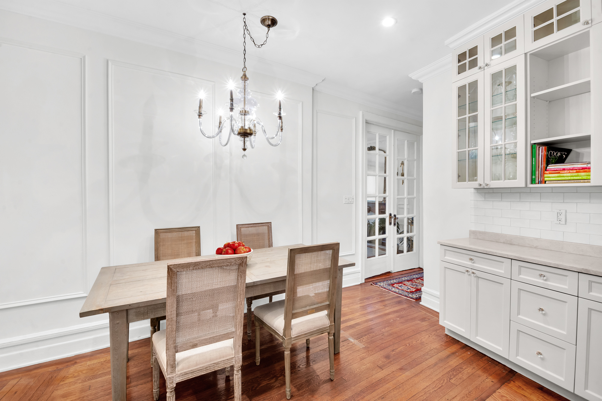 47 Fort Washington Avenue, Unit 55 Manhattan, NY 10032 - Photo 9 of 20 a view of a dining room and livingroom with furniture wooden floor a chandelier