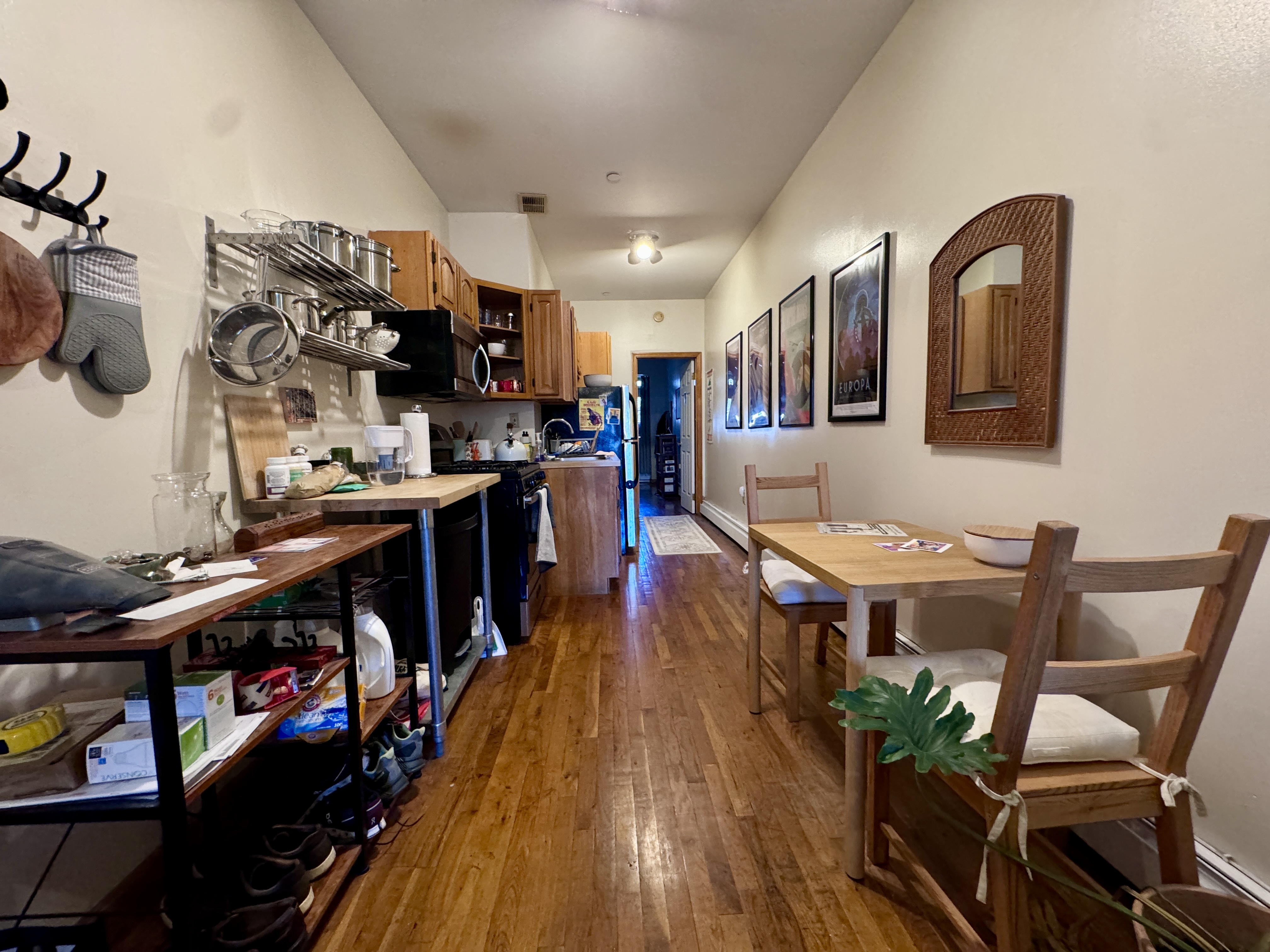 379 Baltic Street, Unit Undisclosed Brooklyn, NY 11201 - Photo 7 of 10 a living room with lots of furniture and gym equipment