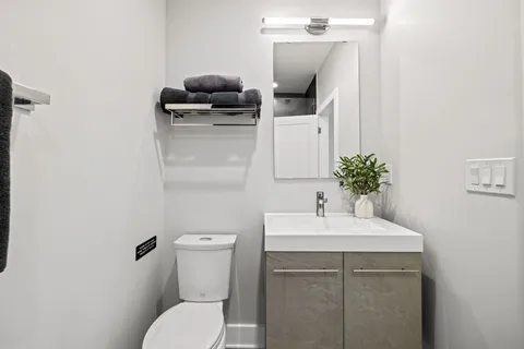 a en suite bathroom with a sink and a mirror