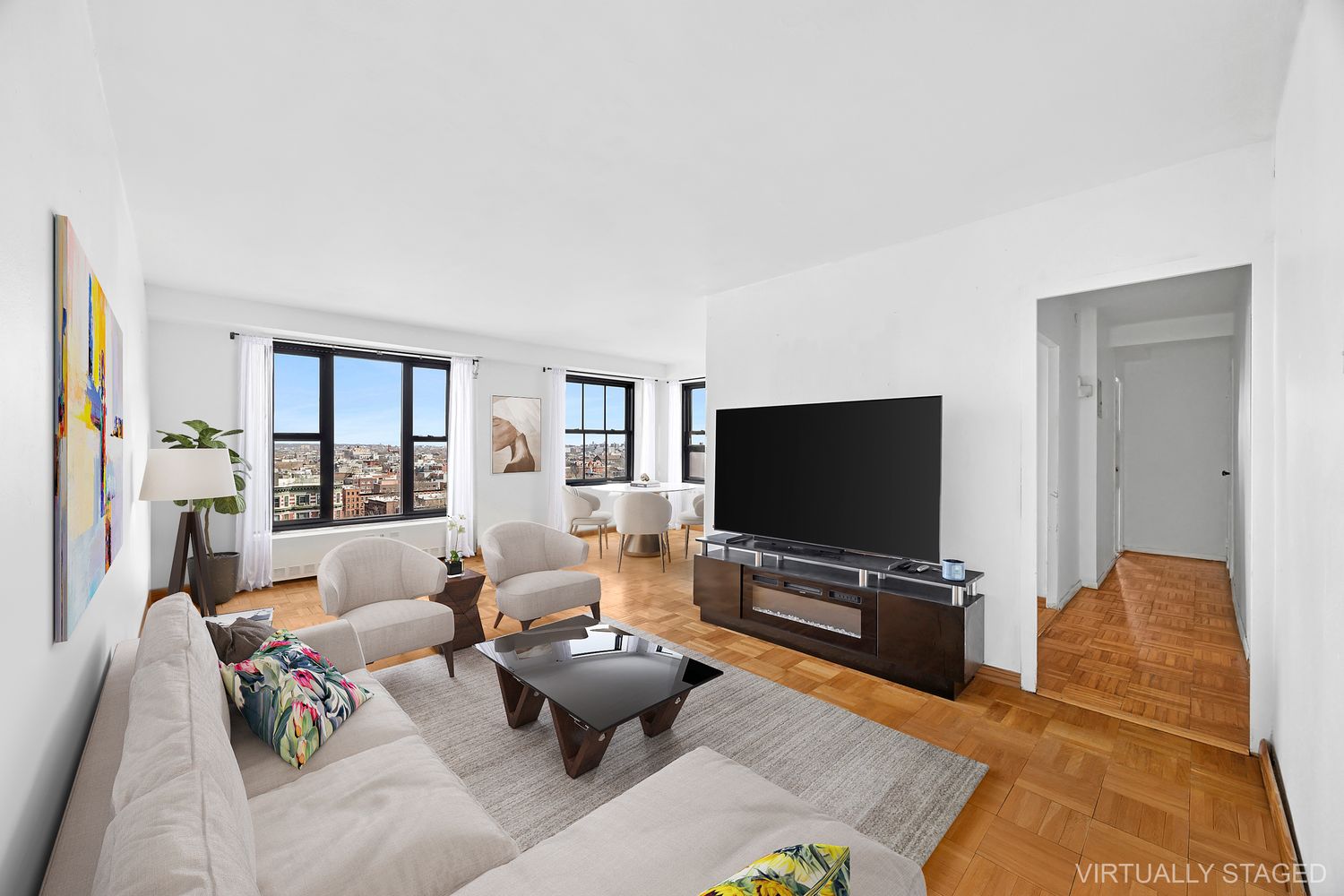 a living room with furniture and a flat screen tv