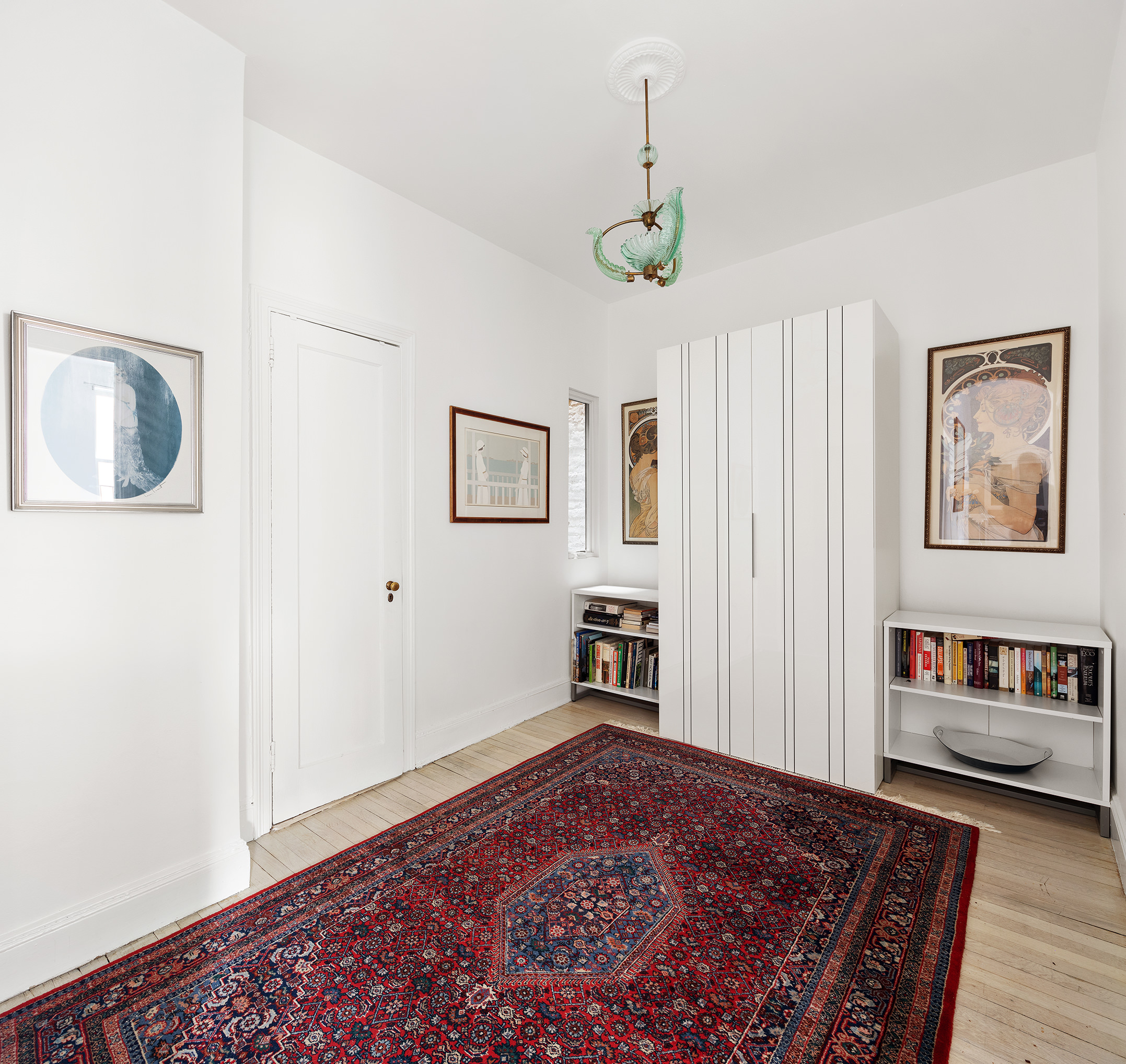 525 East 84th Street, Unit 3B Manhattan, NY 10028 - Photo 6 of 10 a view of a bedroom with wooden floor and window