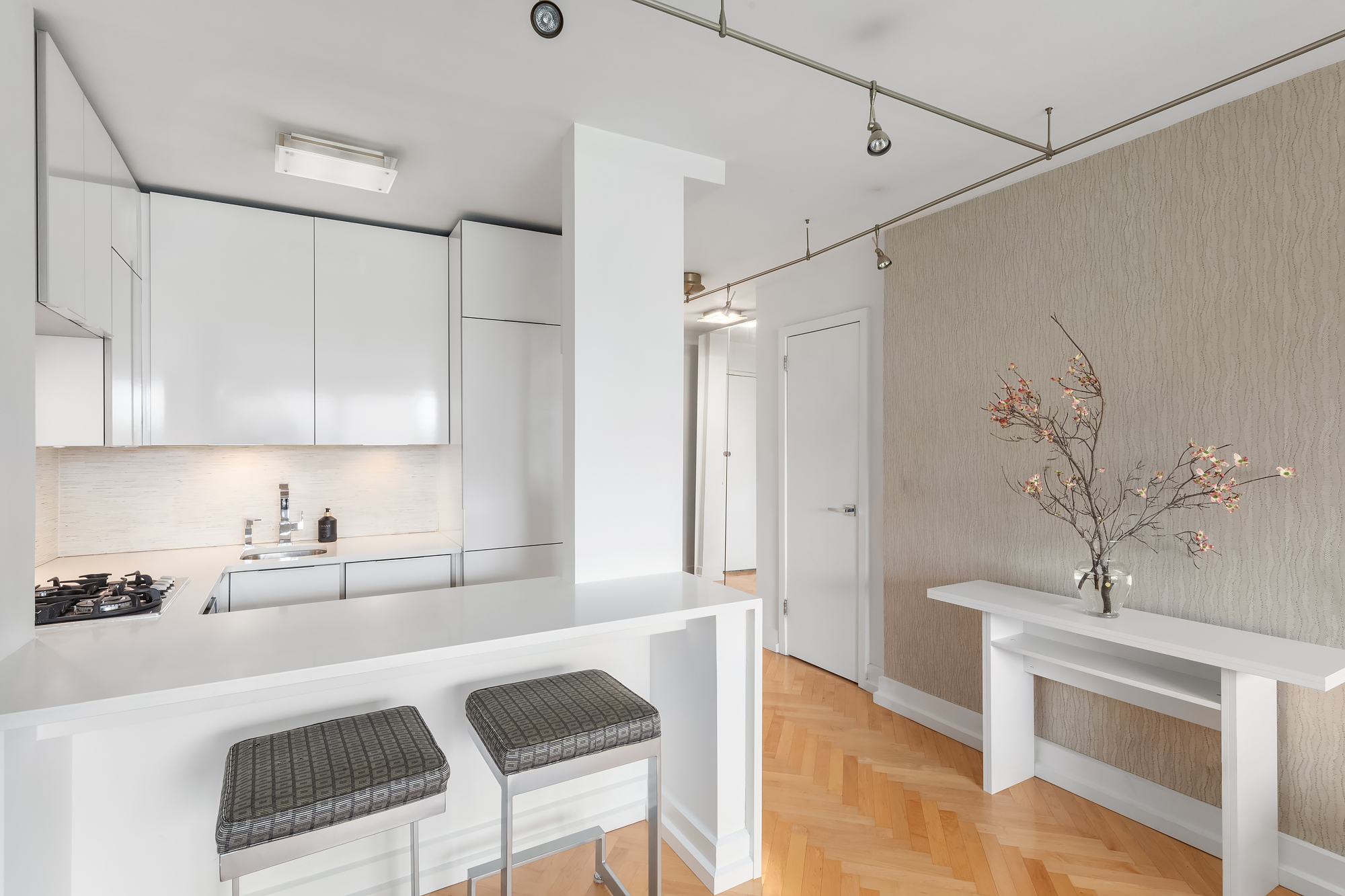 101 West 12th Street, Unit 12B Manhattan, NY 10011 - Photo 4 of 10 a kitchen with a sink cabinets and window