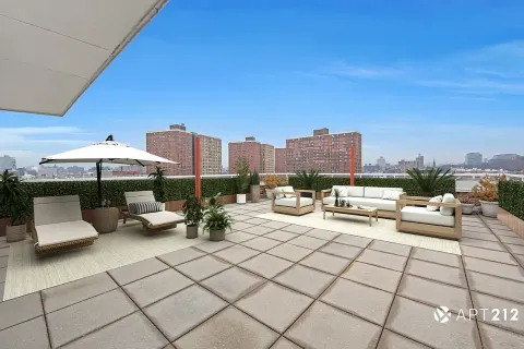 a view of roof deck with seating area