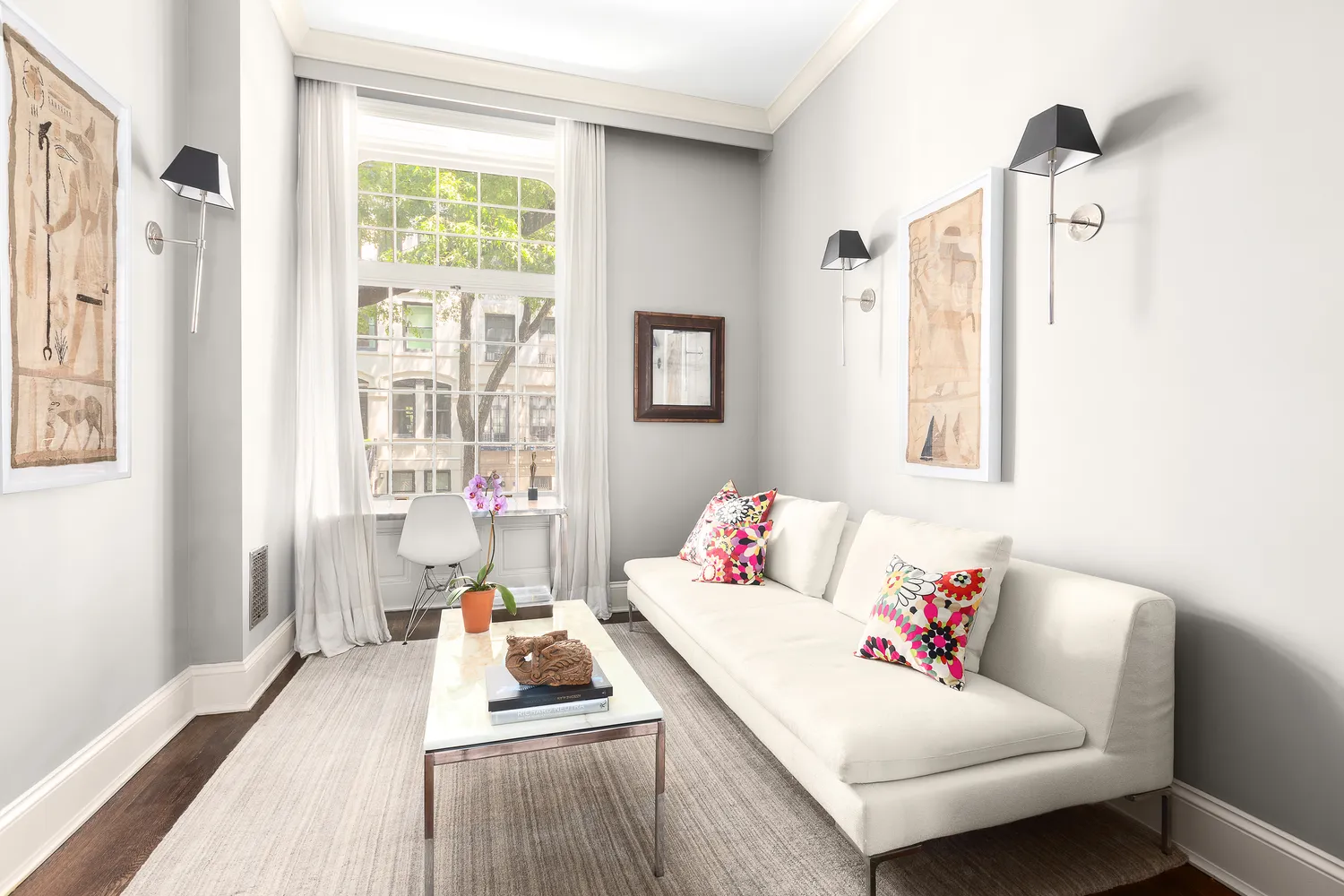 a living room with furniture and a window