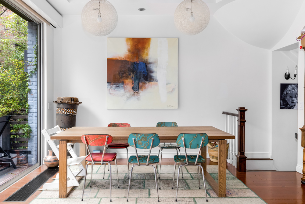 308 West 19th Street, Unit GARDEN Manhattan, NY 10011 - Photo 8 of 18 a view of a dining room with furniture and wooden floor