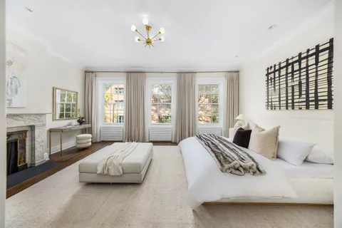 a bedroom with a bed and a couch