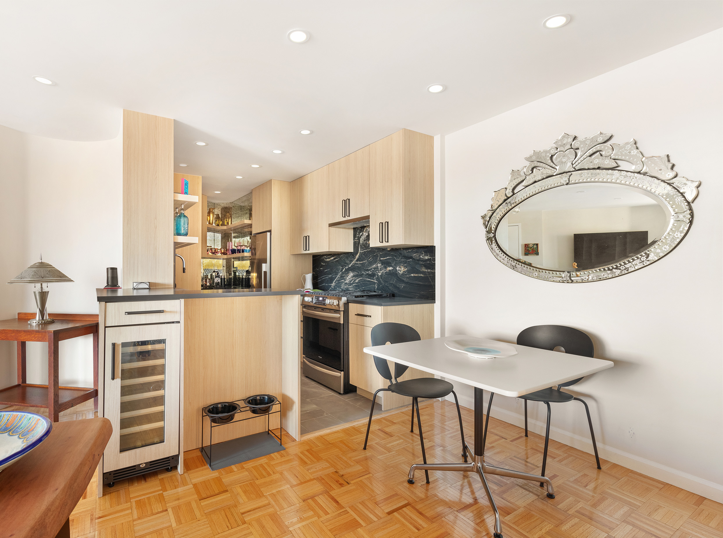 225 West 83rd Street, Unit 19A Manhattan, NY 10024 - Photo 6 of 15 a kitchen with a sink cabinets and window