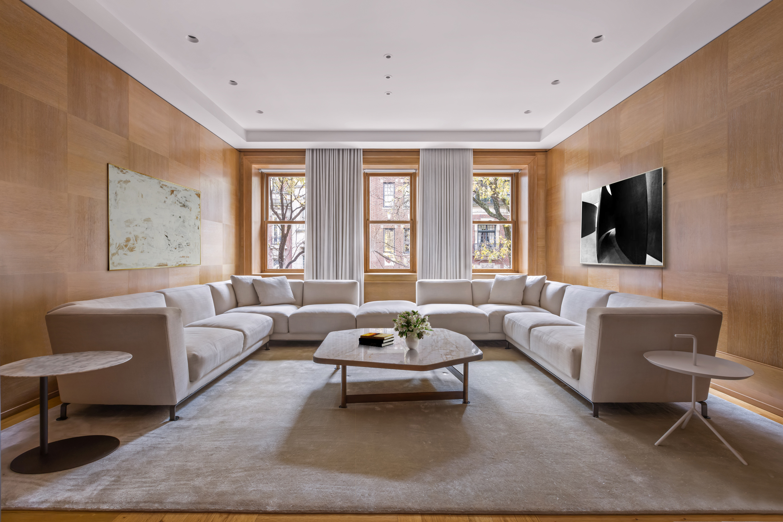 45 East 74th Street Manhattan, NY 10021 - Photo 10 of 33 a living room with furniture a rug and a flat screen tv