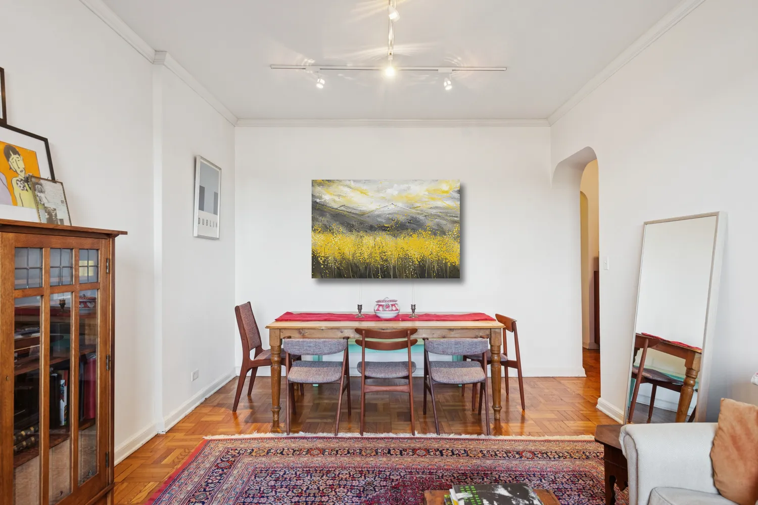 a dining room with furniture and wooden floor