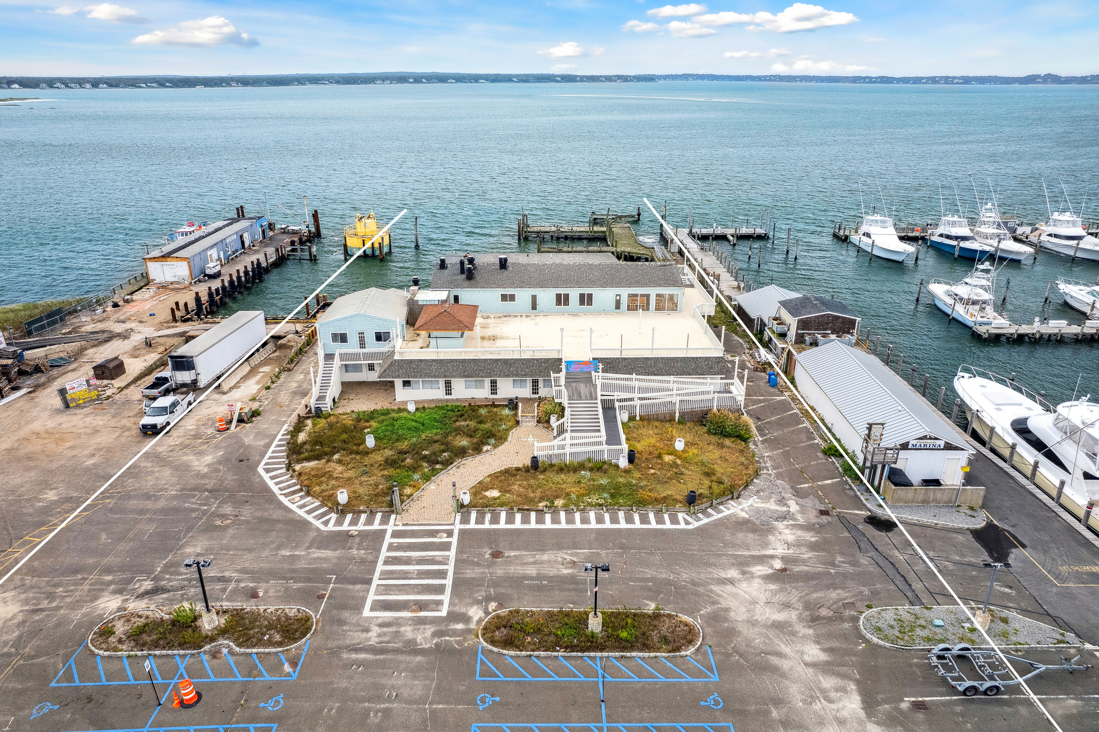 363 Beach Road Hampton Bays, NY 11959 - Photo 8 of 26 a picture of a table and chairs on the terrace