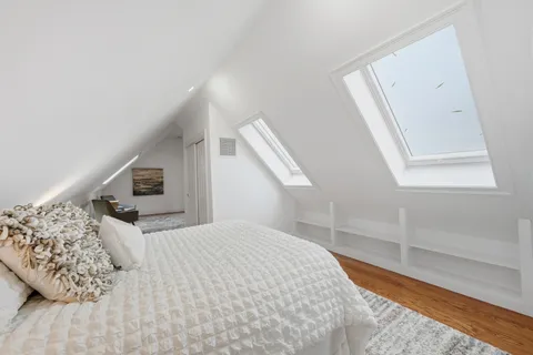 a view of room with window and wooden floor
