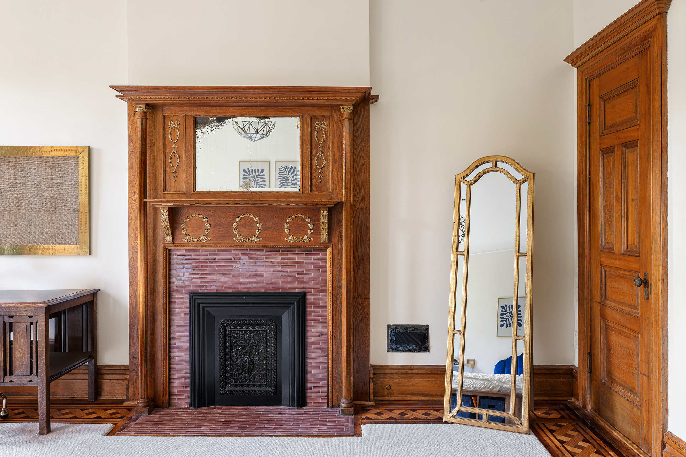 89 West 119th Street Manhattan, NY 10026 - Photo 12 of 22 a living room with furniture and a fireplace
