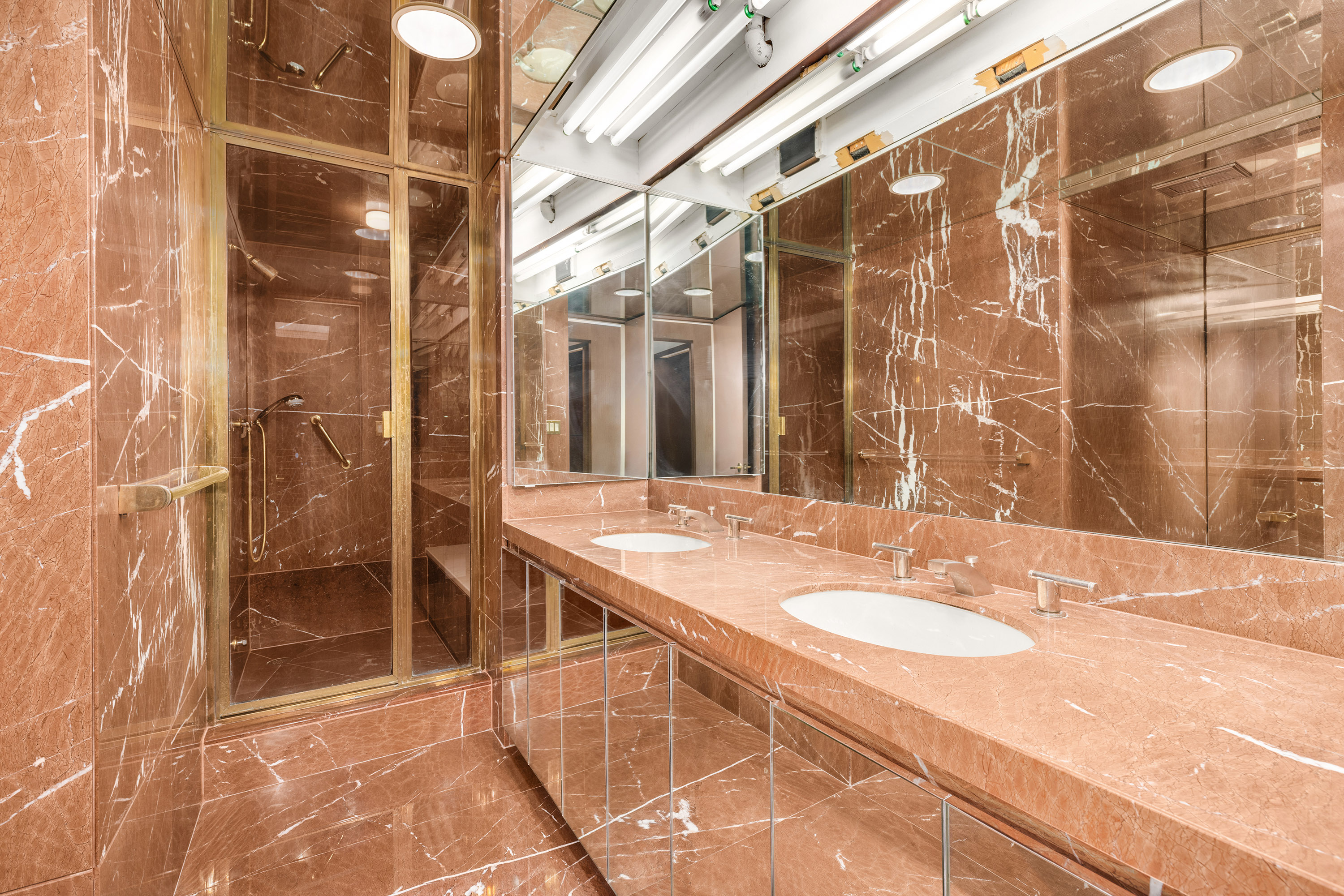 860 United Nations Plaza, Unit 35/36D Manhattan, NY 10017 - Photo 9 of 21 a bathroom with a sink and a mirror