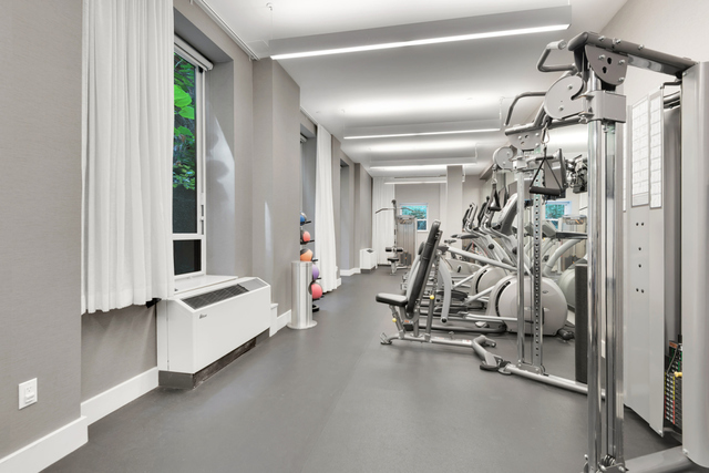 432 West 52nd Street, Unit 3C Manhattan, NY 10019 - Photo 3 of 5 a view of a room with gym equipment