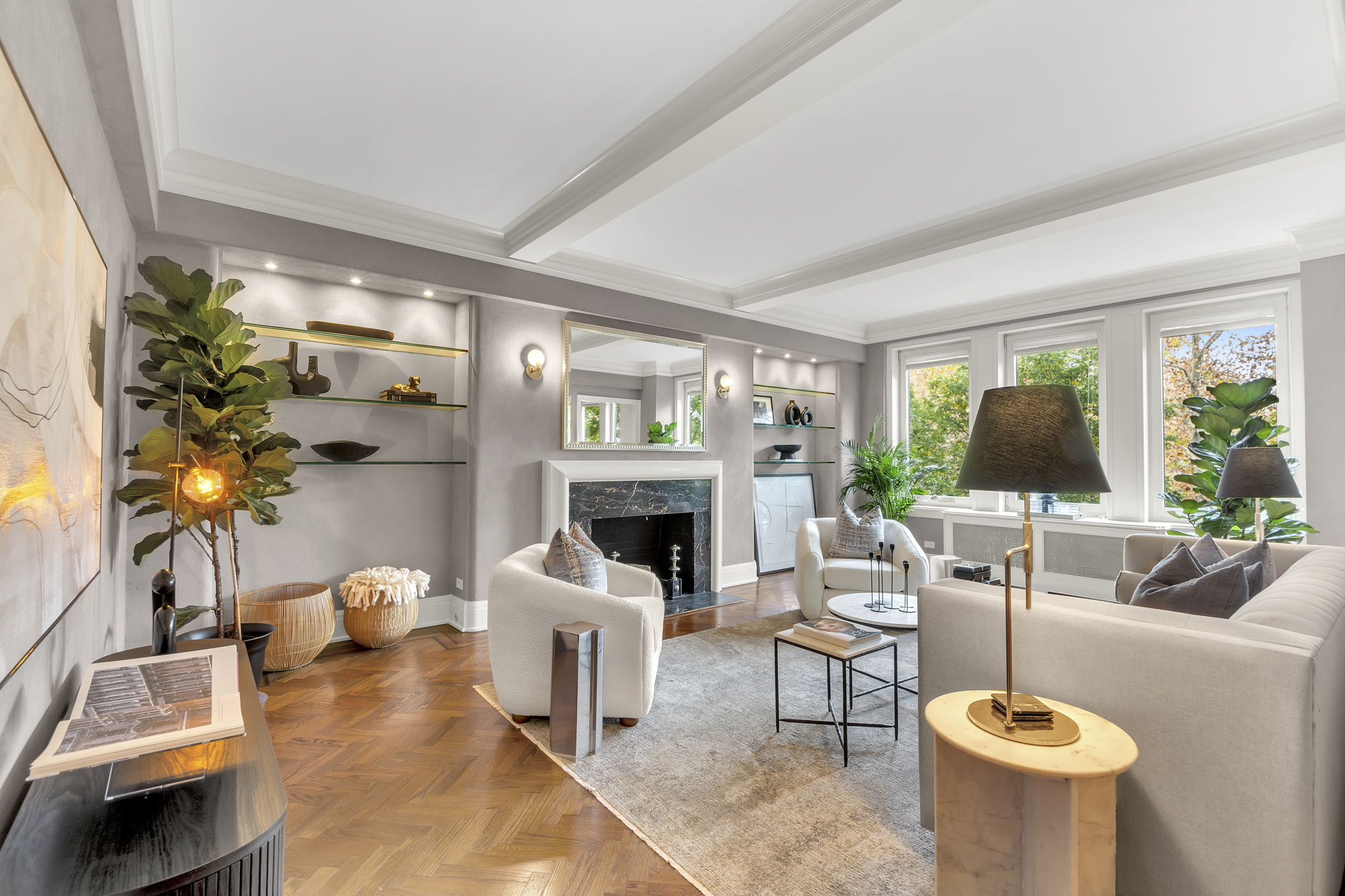 7 Gracie Square, Unit 5A Manhattan, NY 10128 - Photo 3 of 26 a living room with furniture a fireplace and a flat screen tv