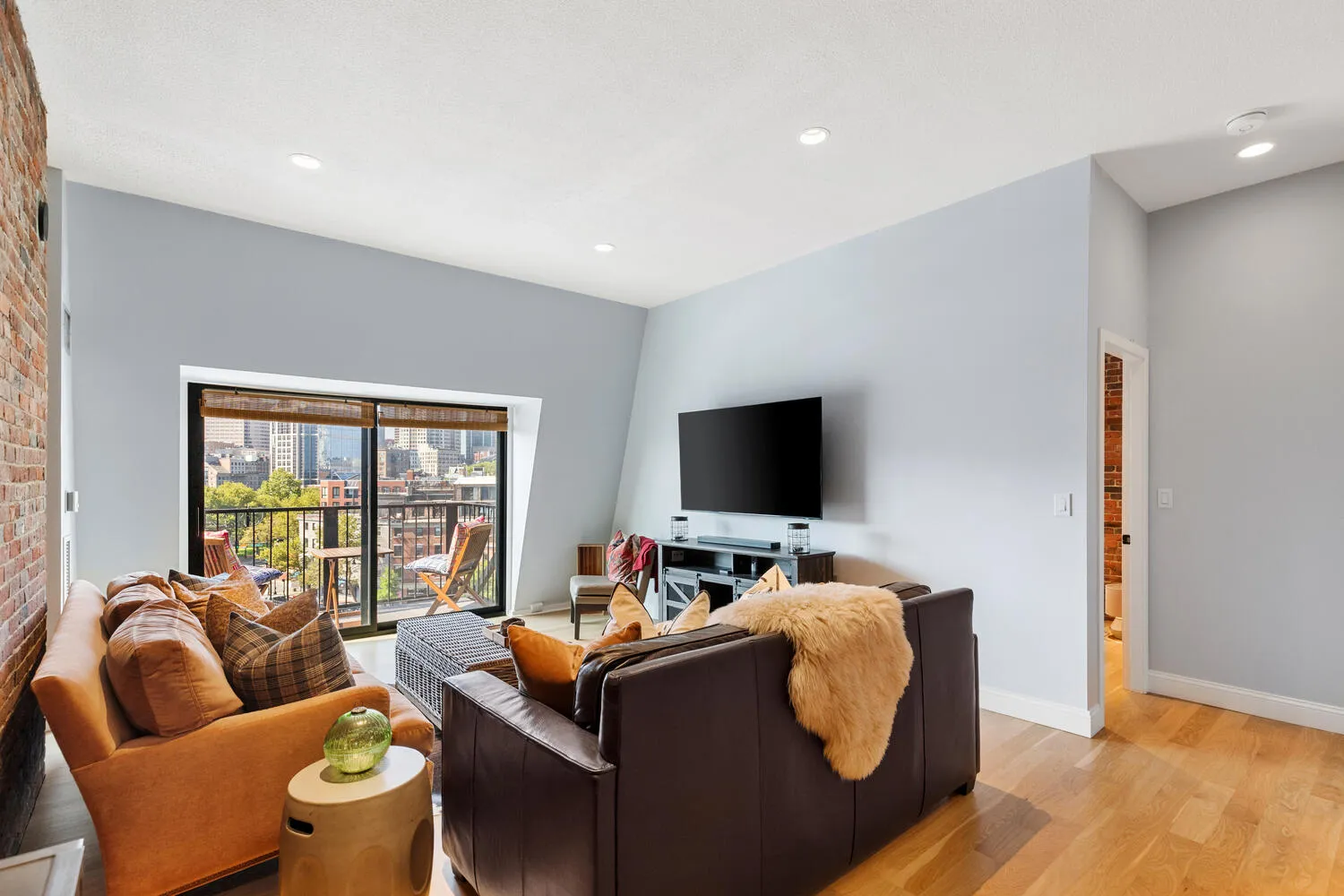 a living room with furniture and a flat screen tv