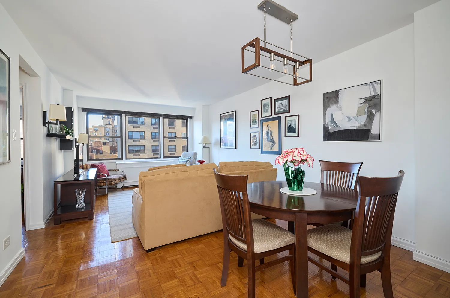 a dining room with furniture and a window