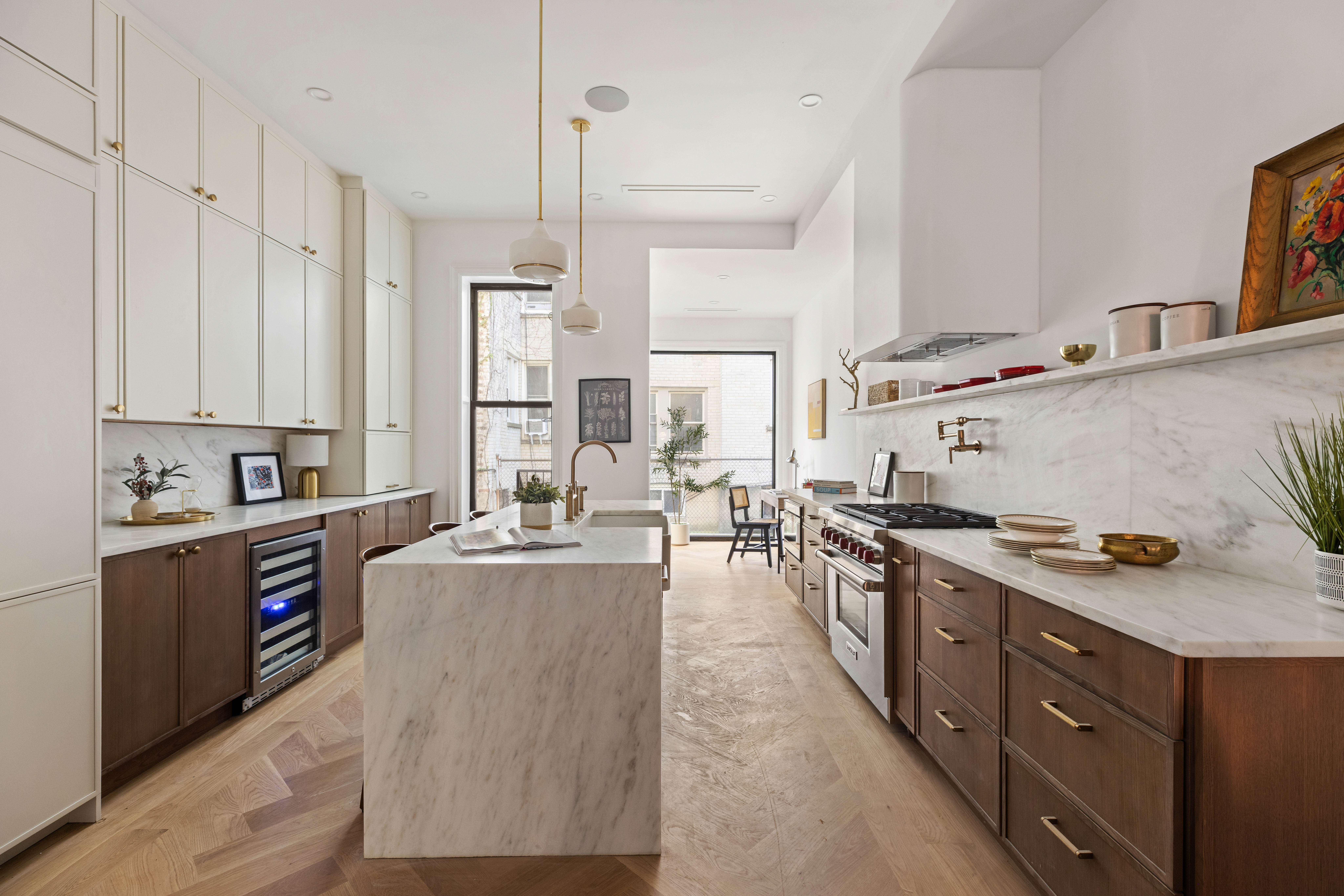 286 Dekalb Avenue Brooklyn, NY 11205 - Photo 5 of 17 a large kitchen with stainless steel appliances a stove a sink dishwasher and cabinets with wooden floor