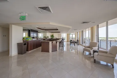 a large kitchen with a table and chairs