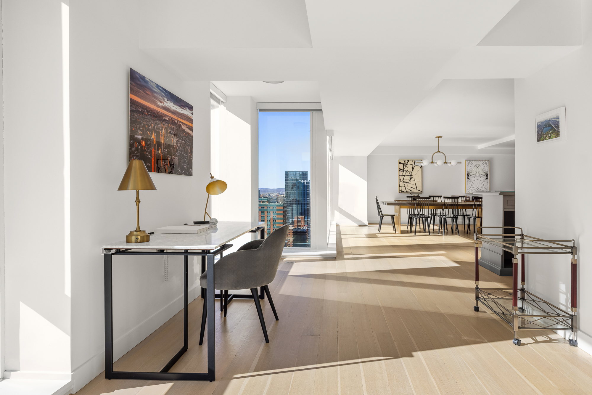 135 West 52nd Street, Unit 40A Manhattan, NY 10019 - Photo 6 of 24 a view of a living room and kitchen