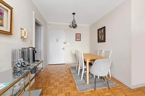 a view of a workspace with furniture and a rug