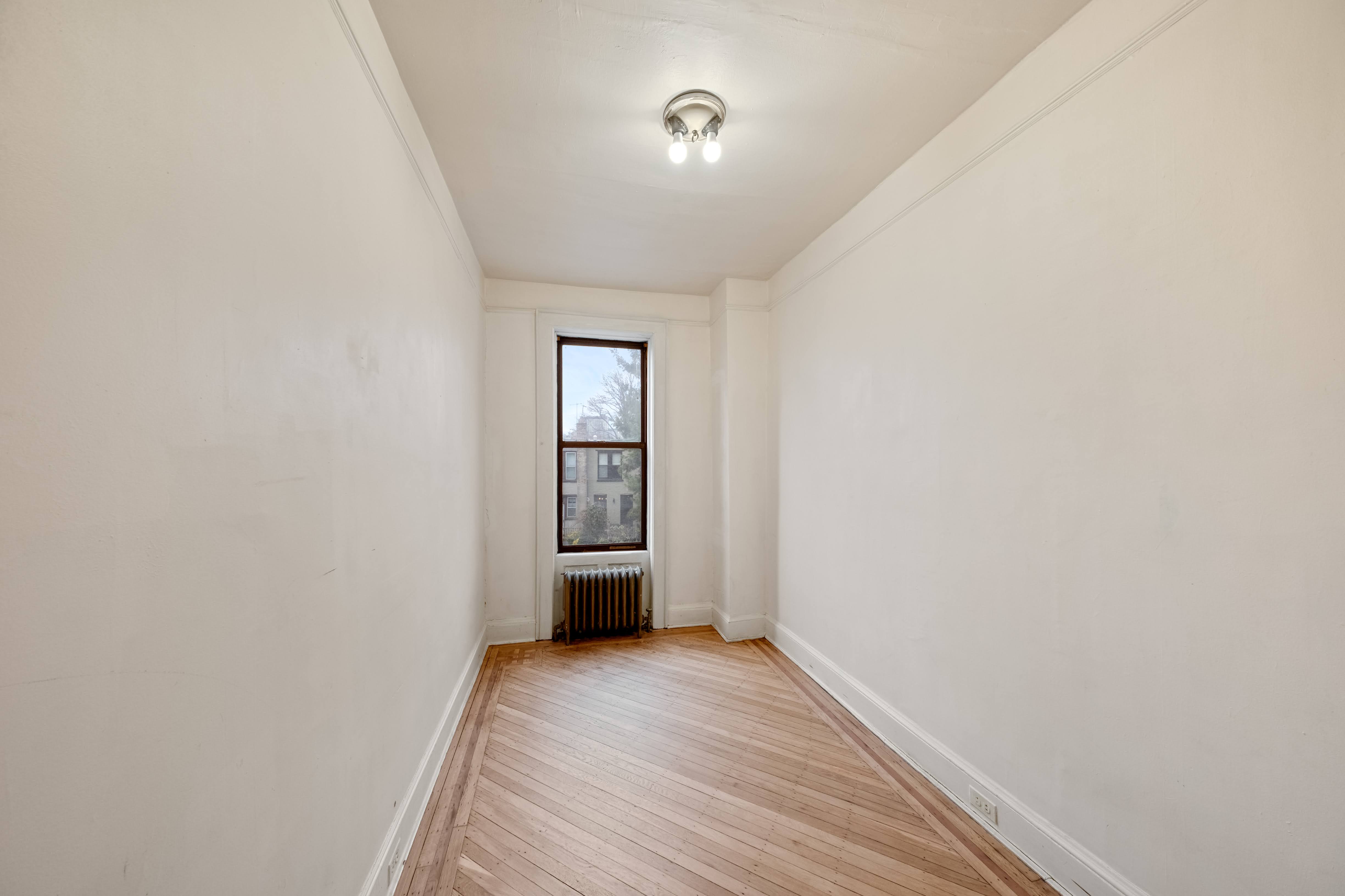 196 Maple Street Brooklyn, NY 11225 - Photo 15 of 31 a view of livingroom with wooden floor