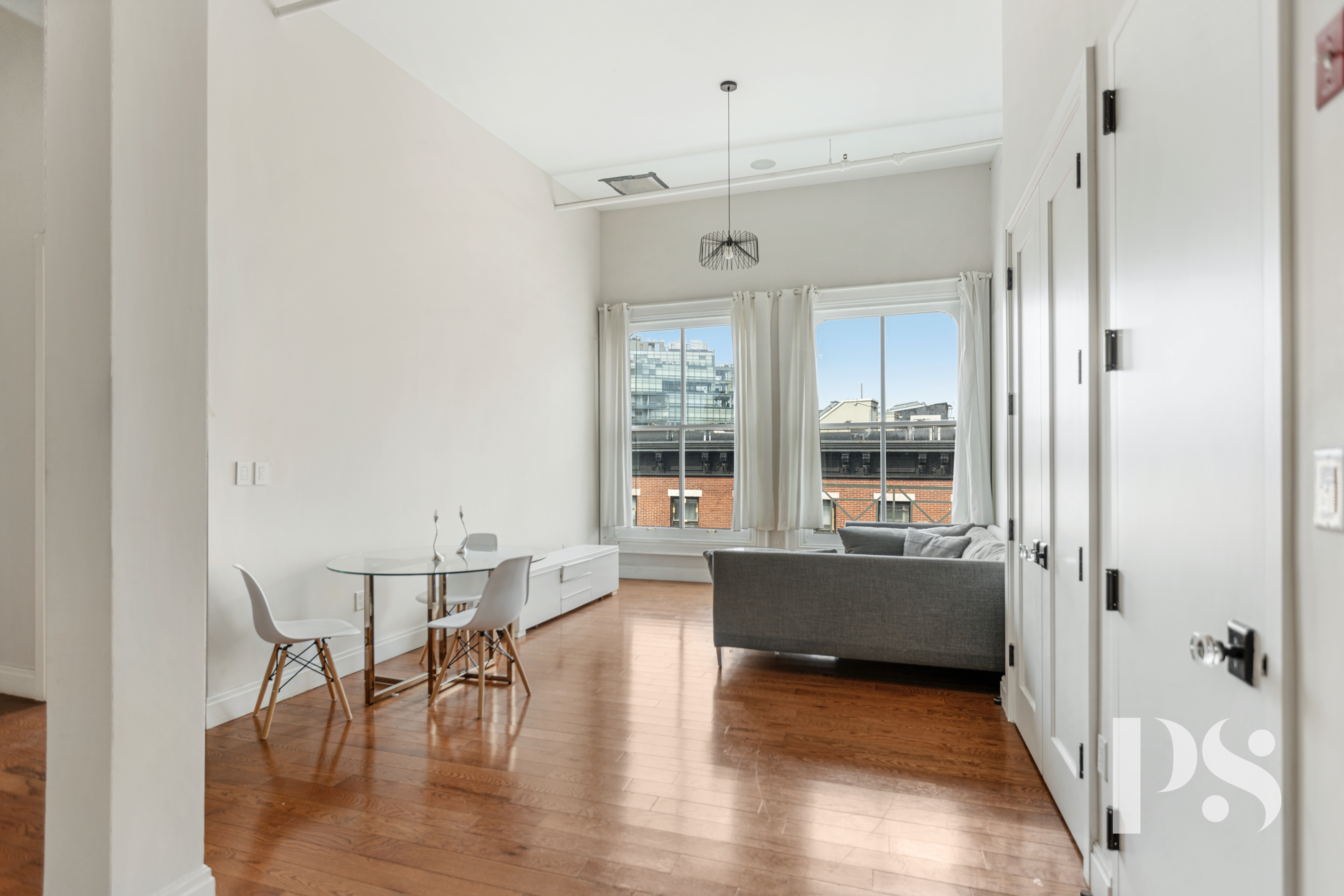2 Wooster Street, Unit 5A Manhattan, NY 10013 - Photo 2 of 12 wooden floor and dining room view with a large window