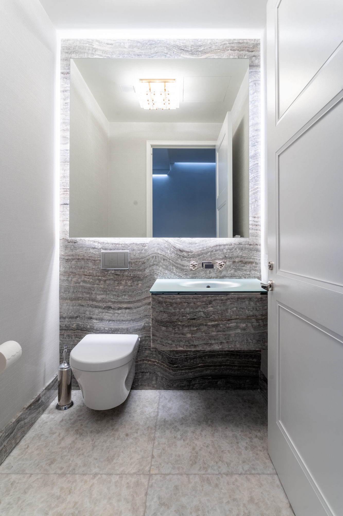 35 Hudson Yards, Unit 5903 Manhattan, NY 10001 - Photo 14 of 15 a bathroom with a granite countertop sink mirror and toilet