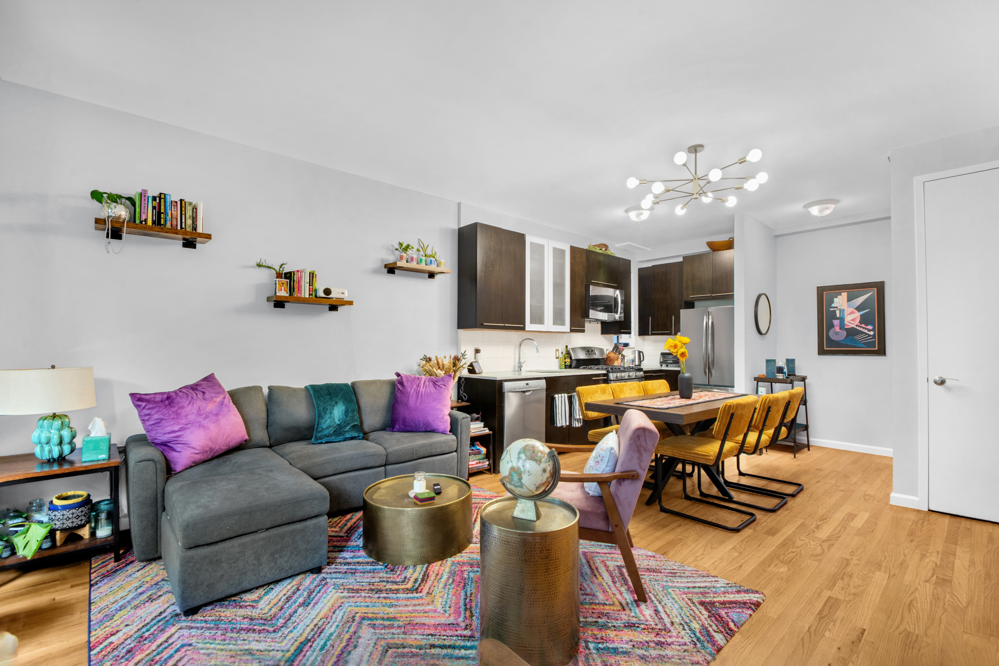 5 West 127th Street, Unit 1B Manhattan, NY 10027 - Photo 4 of 11 a living room with furniture and wooden floor