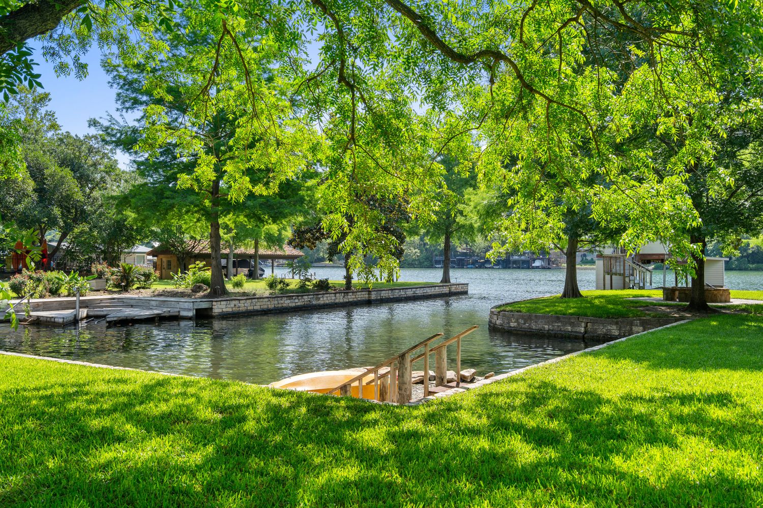a view of a lake with houses with outdoor space