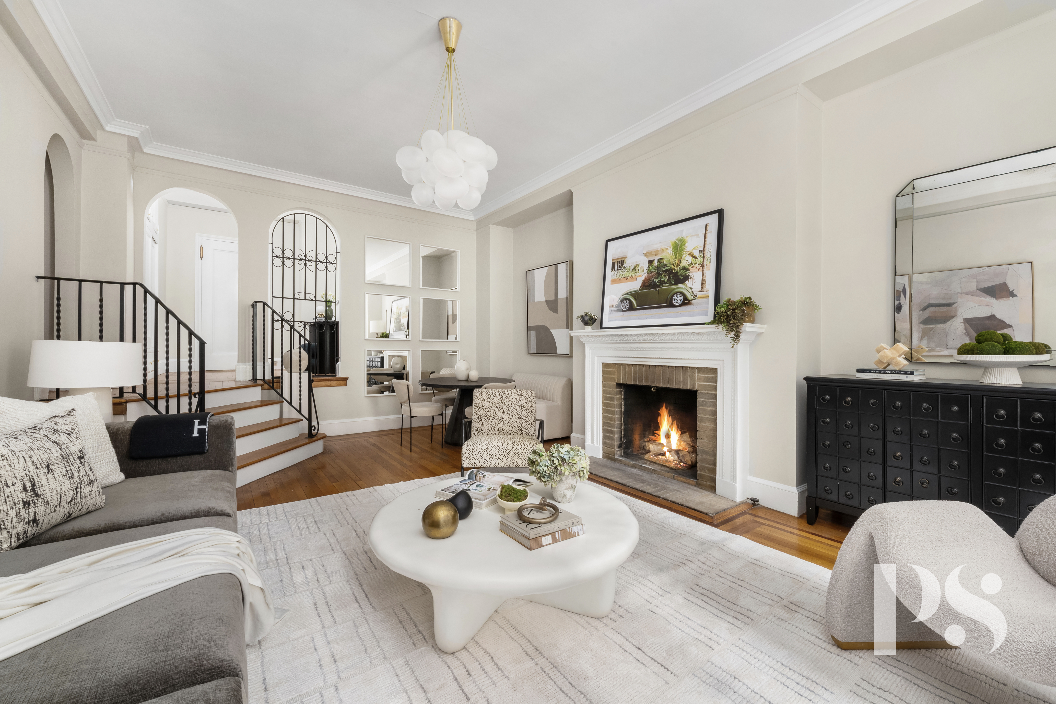 35 East 9th Street, Unit 33 Manhattan, NY 10003 - Photo 6 of 14 a living room with furniture a fireplace and window