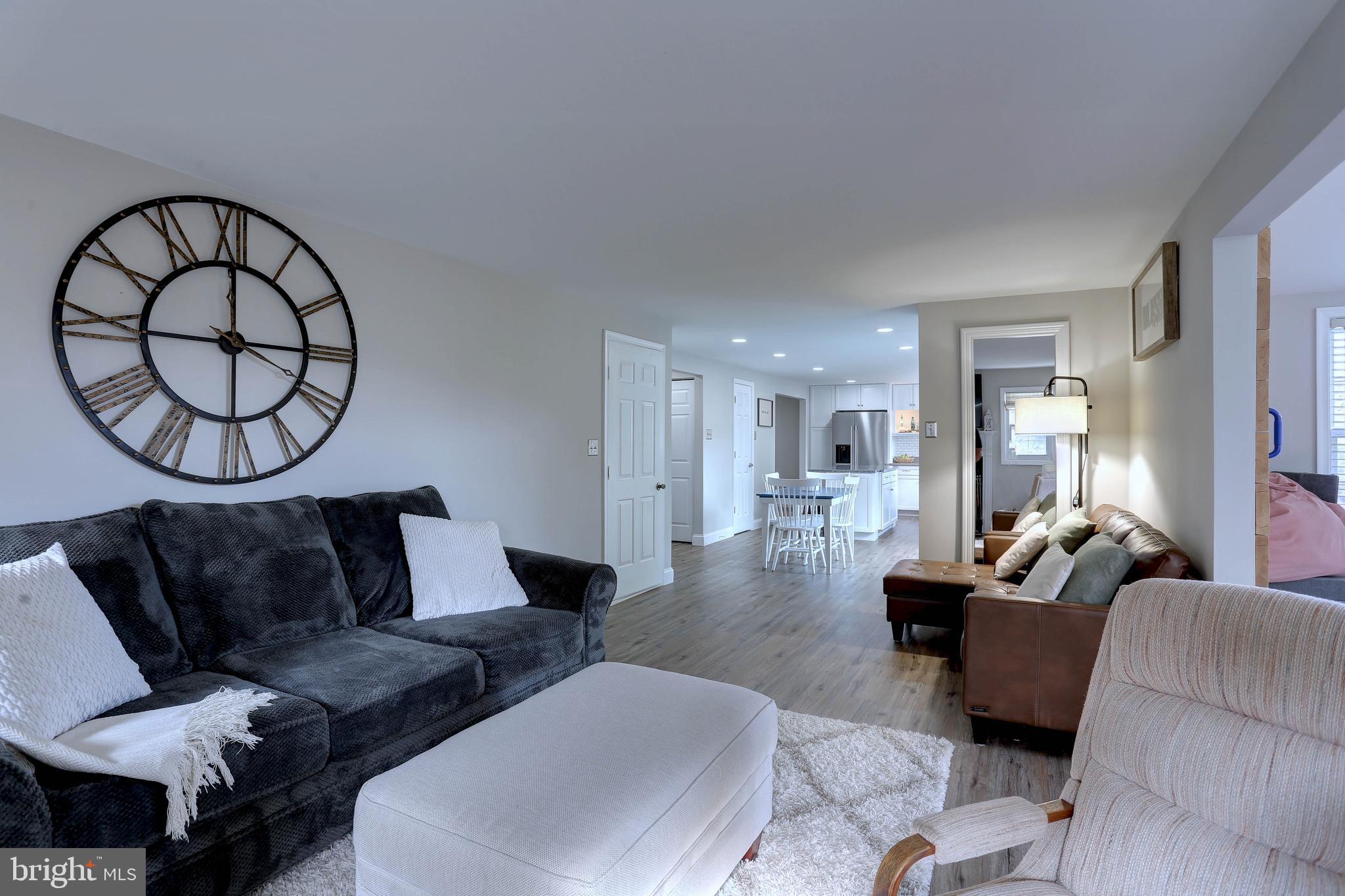 6257 Fairbourne Court Hanover, MD 21076 - Photo 15 of 47 a living room with furniture and a large window