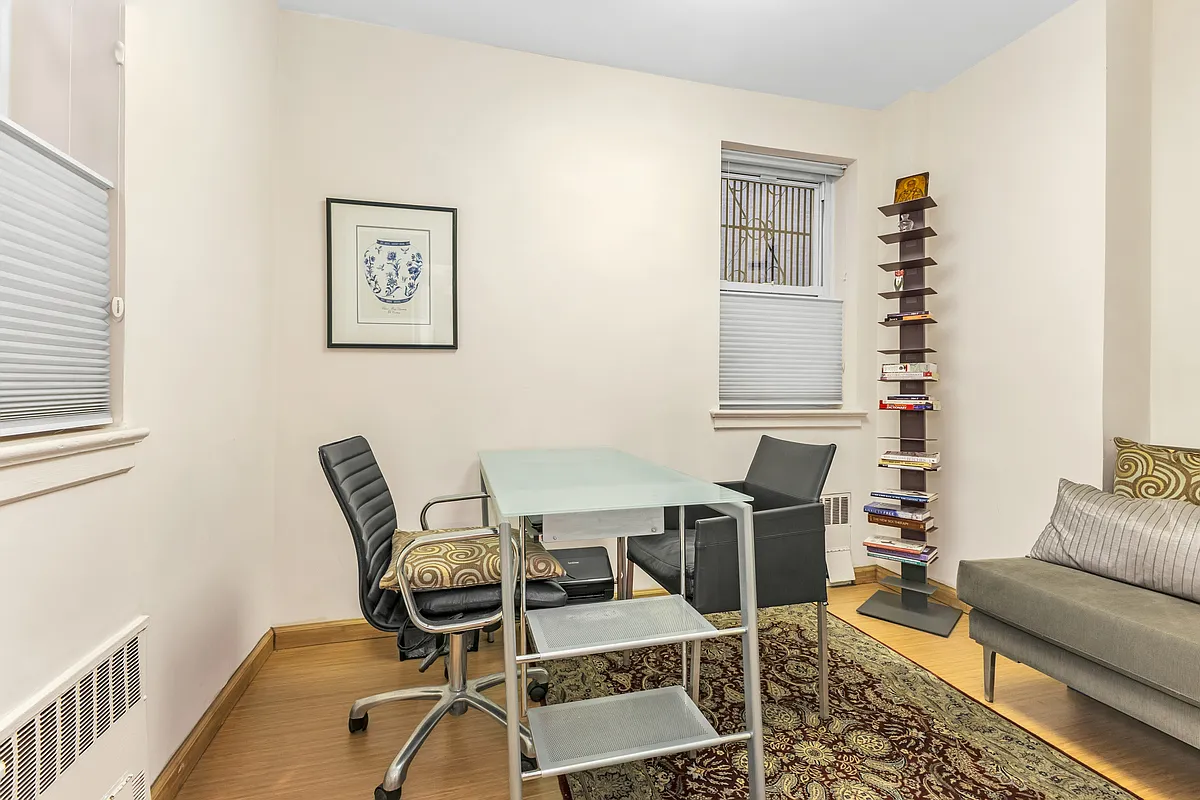 936 5th Avenue, Unit MOC2 Manhattan, NY 10021 - Photo 5 of 14 a work room with furniture wooden floor and windows